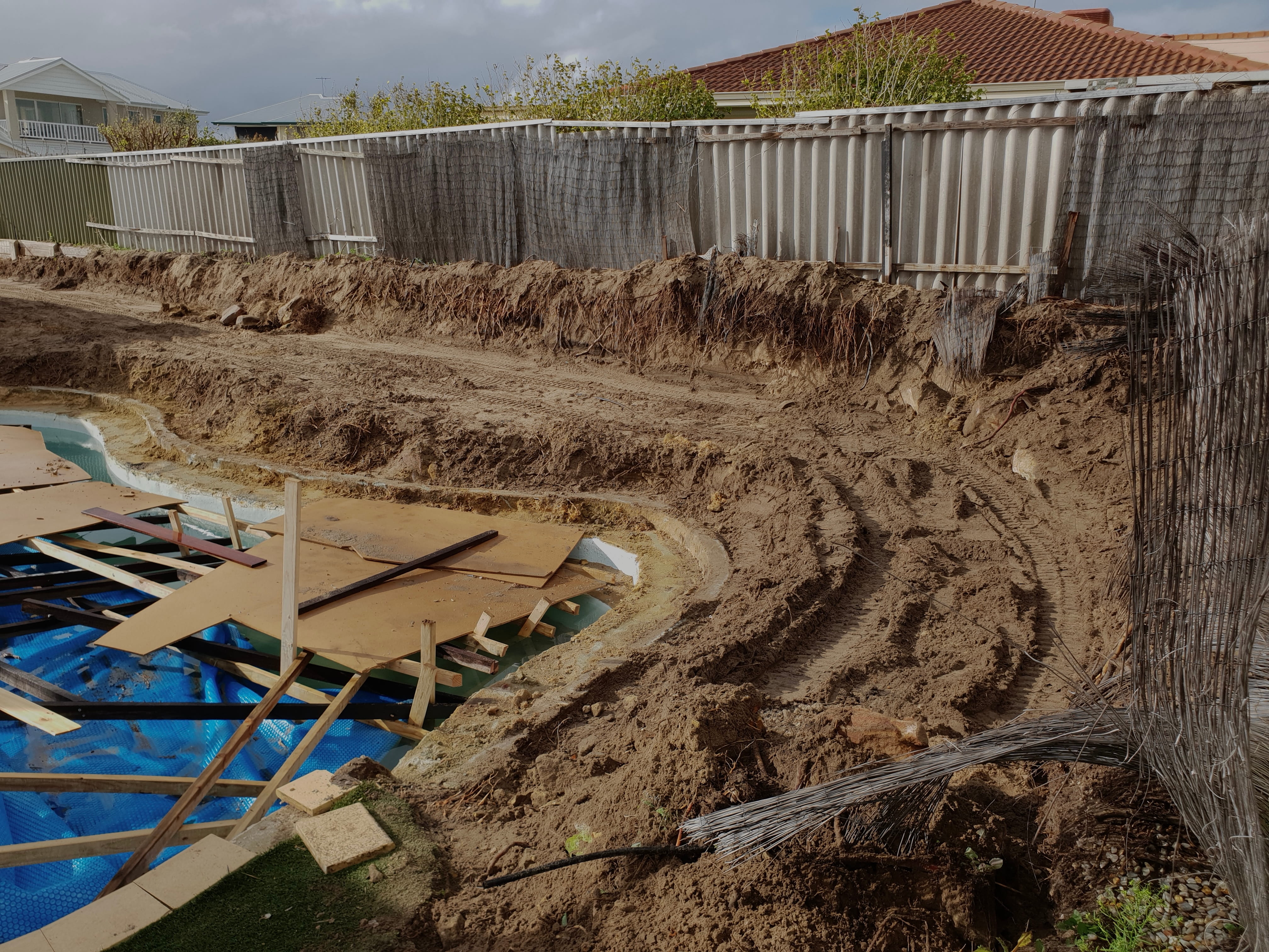 Old cracked driveway before replacement at a Perth home